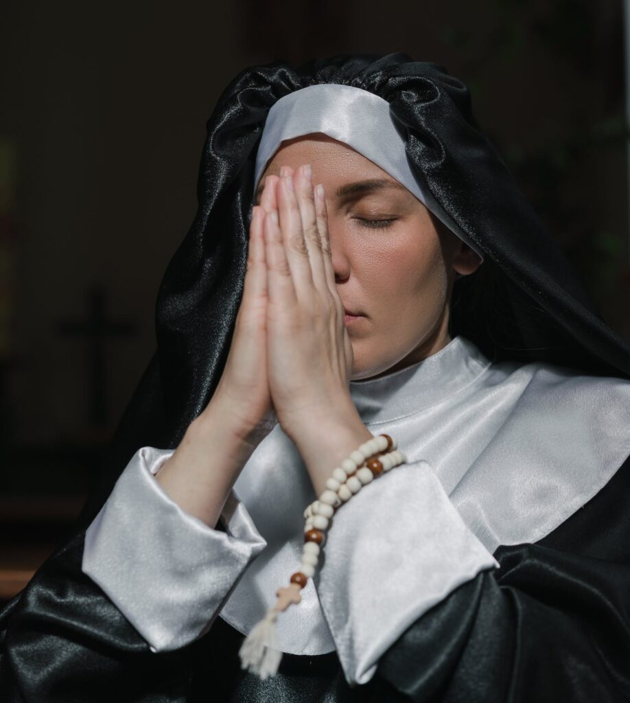 Close-up of a Nun Praying